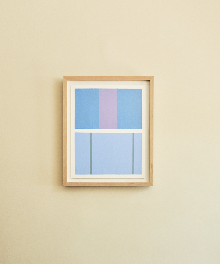 Close-up of Magnetic Color Field, framed in wood on tan wall.