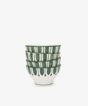 The Jorge Cereal Bowl Set includes four white ceramic bowls featuring green vertical stripes and dots, inspired by traditional Portuguese designs, displayed on a plain white background.
