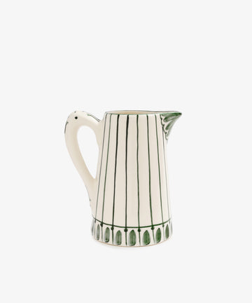 The Jorge Jug is a green-and-white Portuguese ceramic jug with vertical green lines, a traditional patterned base, a handle, and a spouted rim.
