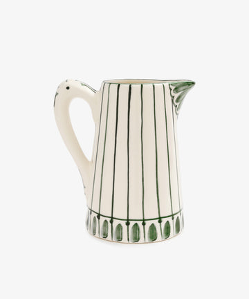 The Jorge Jug is a white ceramic pitcher with vertical green stripes, a patterned green rim, a handle, and spout—ideal as a centerpiece vase for your summer table.