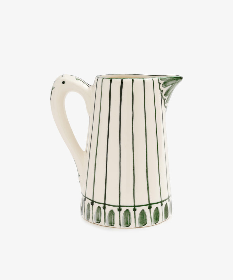 The Jorge Jug is a white ceramic pitcher with vertical green stripes, a patterned green rim, a handle, and spout—ideal as a centerpiece vase for your summer table.