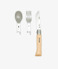 The Picnic Plus & Knife, Set of 2 features a reusable metal spoon and fork with slotted handles placed next to a wooden-handled folding knife—an ideal on-the-go cutlery set—displayed against a plain white background.