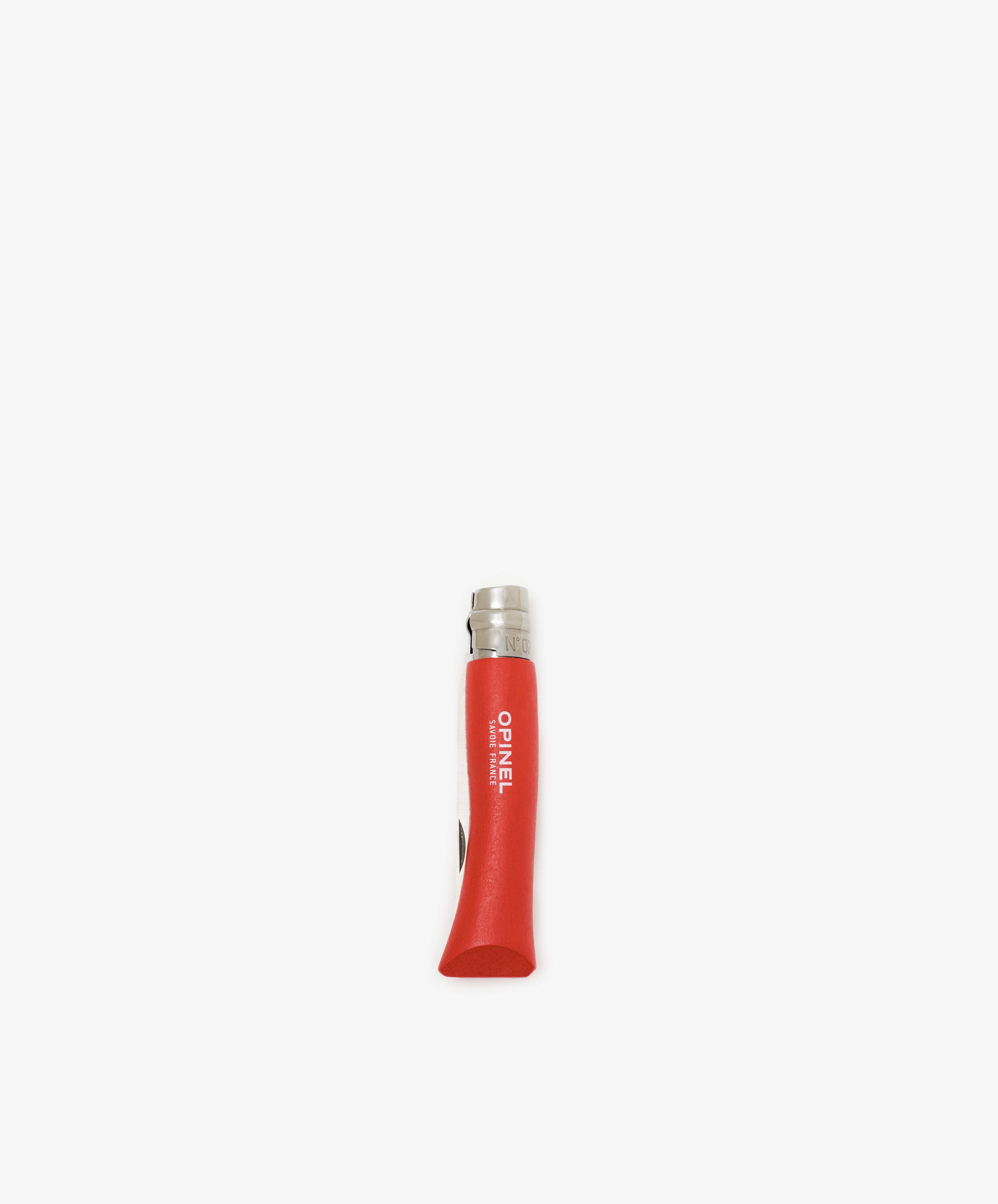 The Primo Kids Knife is a closed, red-handled Opinel French folding knife with a stainless steel blade, shown upright against a white background—perfect for beginners and outdoor carving.