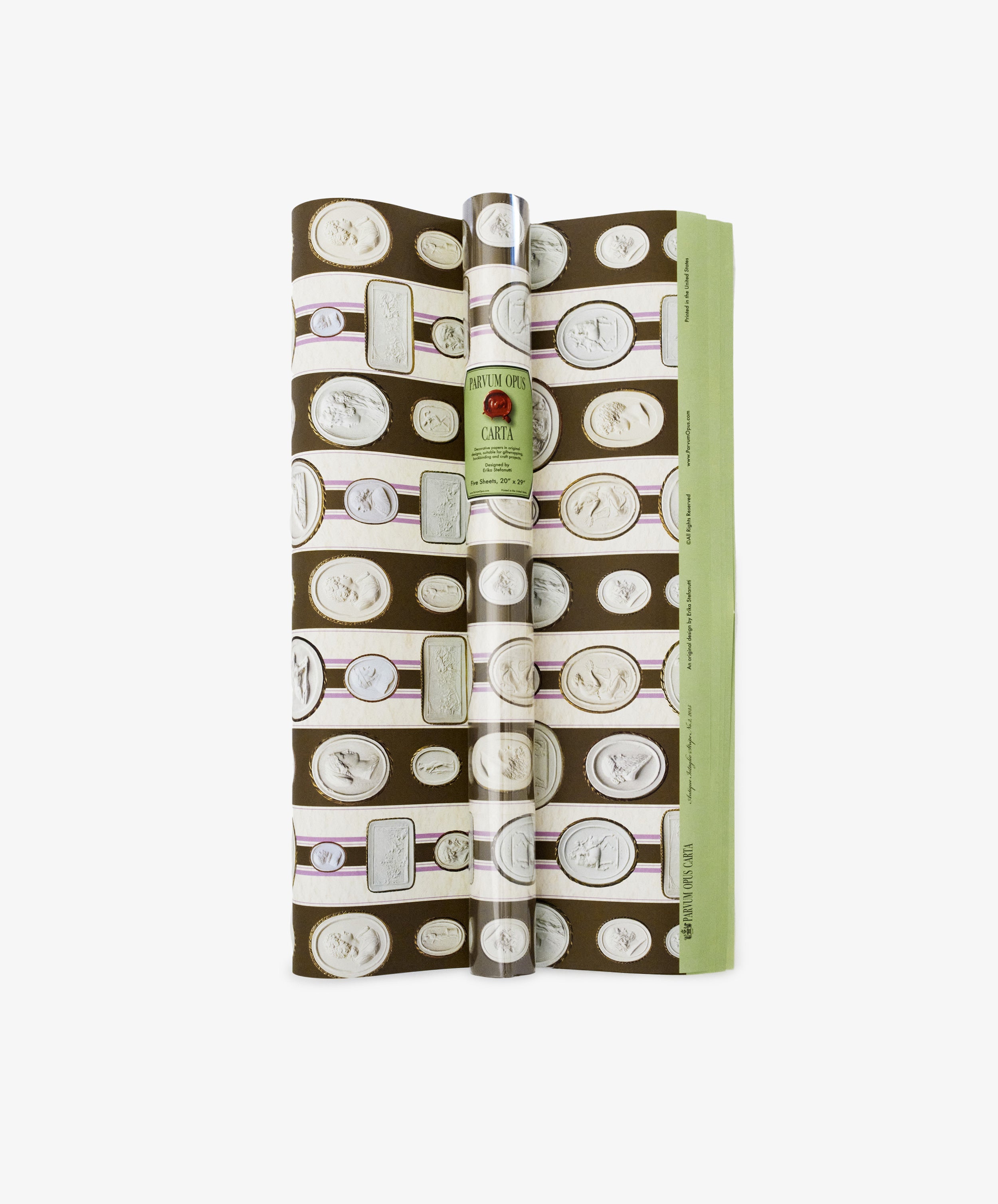 Intaglio Stripe Gift Wrap, with a brown background and all-over coin and medallion print, shown partially unrolled on a white surface.