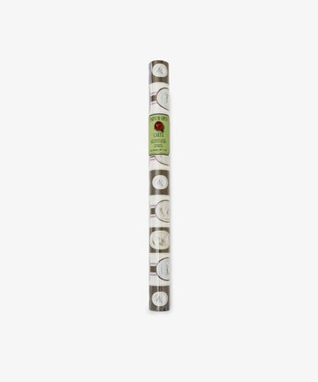Intaglio Stripe Gift Wrap: A roll of brown Kraft paper with white circular designs and a central green label, perfect for adding elegant style to any gift for any occasion.