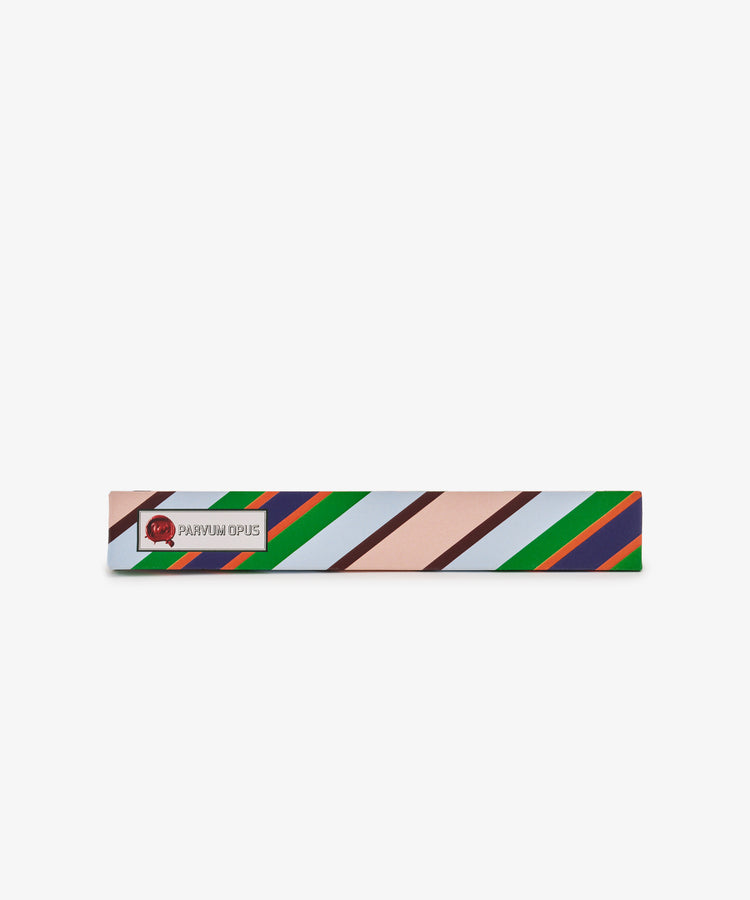 Rectangular box with diagonal stripes in pink, brown, green, blue, and orange—reminiscent of hand-marbled paper—featuring a red logo and Pencil Kit label on the left.