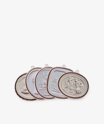Intaglio Tages, Set of 5: This collection features five decorative oval medallions, each crafted from heavy cardstock and adorned with raised classical figures, framed by elegant copper-colored edges. Displayed overlapping in a row, they make the perfect elegant gift tags.