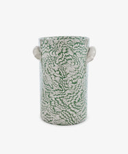 The Celine Wine Cooler is a cylindrical ceramic vessel with two small side handles, adorned with a dense green and white floral pattern on a white background that evokes the look of marbled ceramic artistry.