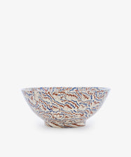 The Celine Salad Bowl is a ceramic salad bowl with a wide rim, showcasing an intricate floral pattern in blue, orange, and beige tones against a white background, beautifully reminiscent of marbled ceramic Agateware.