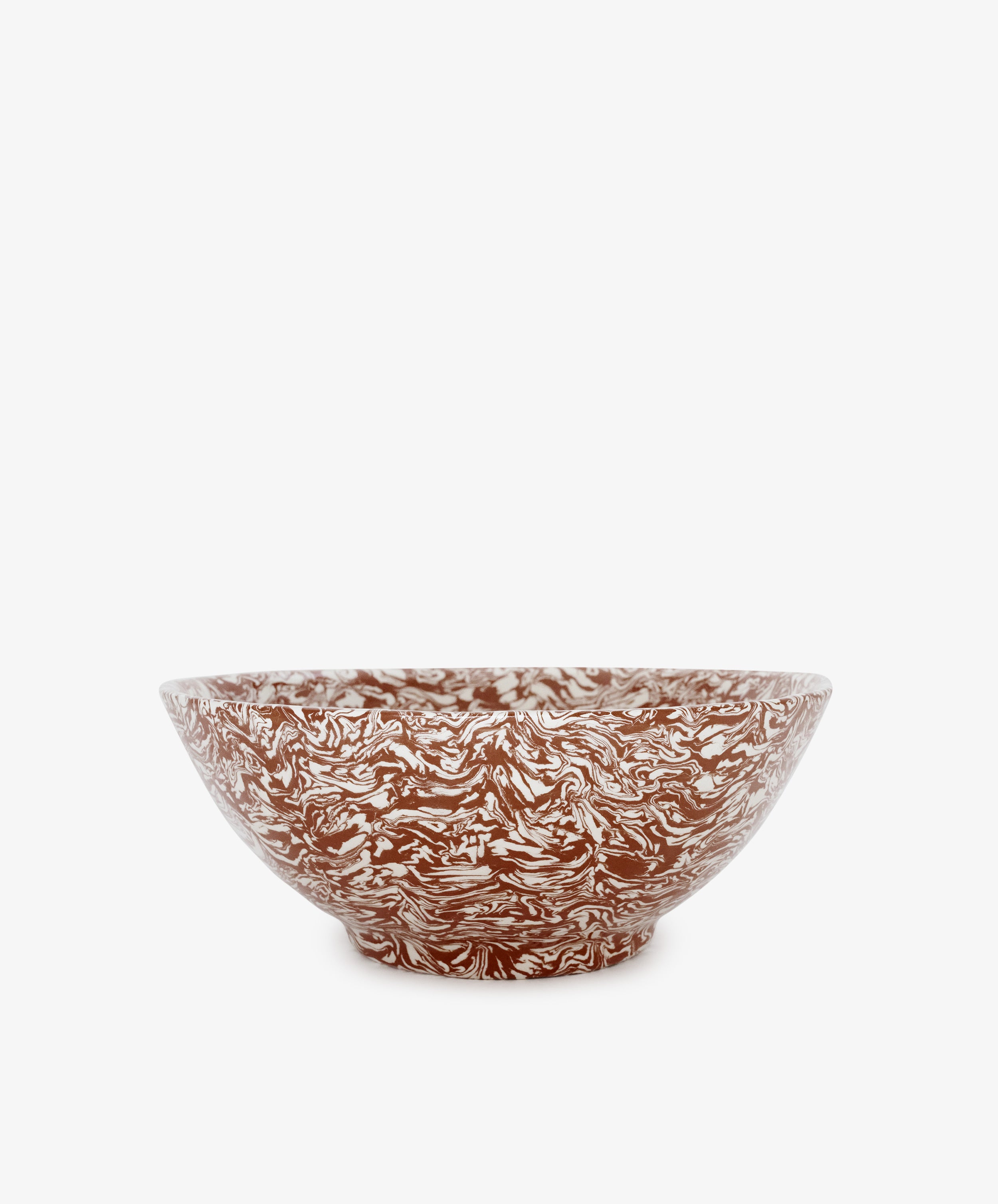The Celine Salad Bowl is a handmade piece featuring brown and white marbled patterns, beautifully displayed against a plain white background.