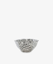 The Celine Snack Bowl is a small handmade bowl with a black and white floral pattern on a plain white background, perfect for snacking.