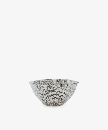 The Celine Snack Bowl is a small handmade bowl with a black and white floral pattern on a plain white background, perfect for snacking.