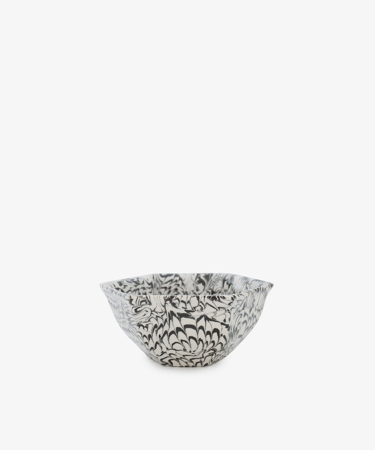 The Celine Snack Bowl is a small handmade bowl with a black and white floral pattern on a plain white background, perfect for snacking.