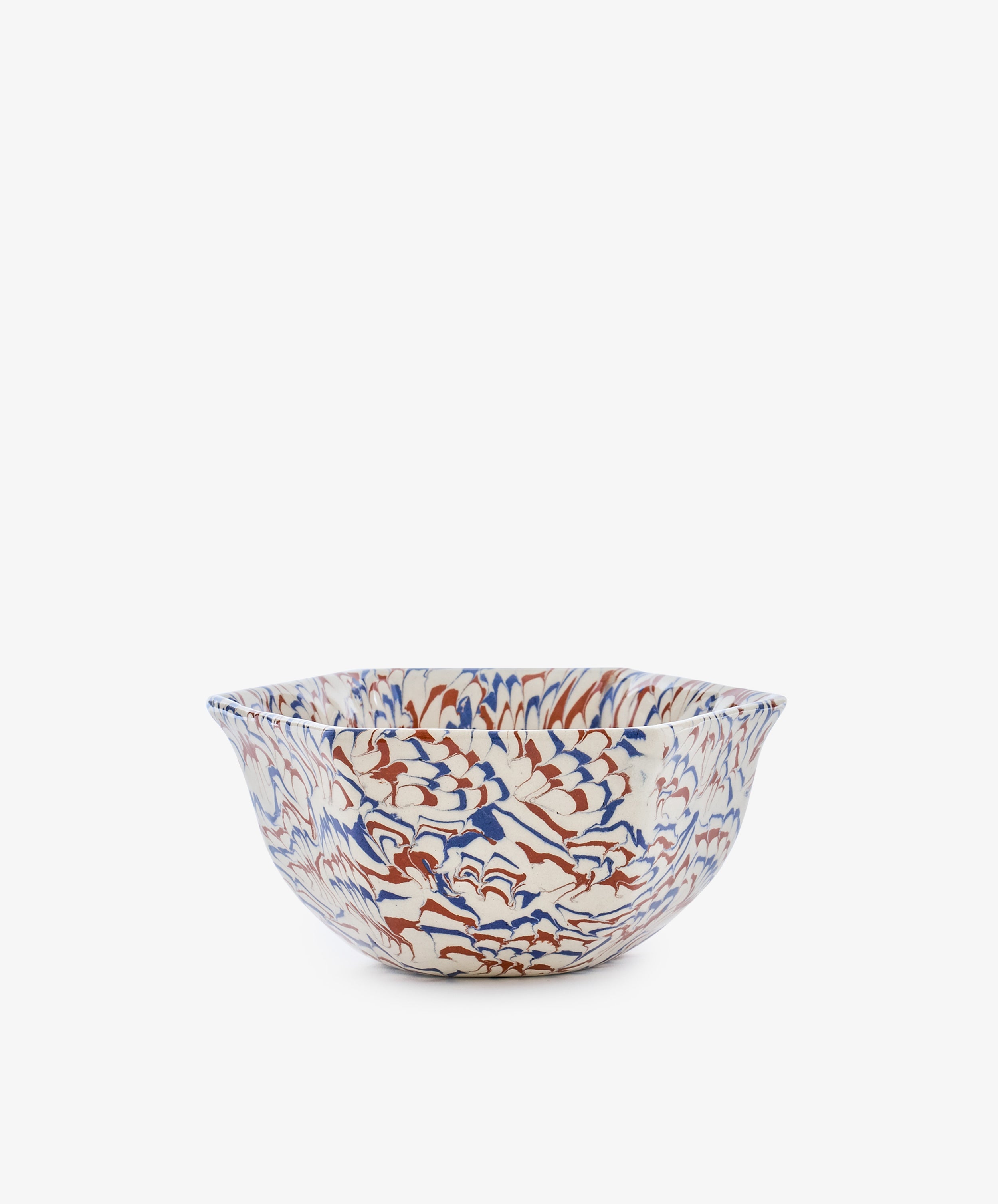 The Celine Snack Bowl showcases an intricate marbled wave pattern in blue, red, and brown on a white background, presented against a plain white surface.