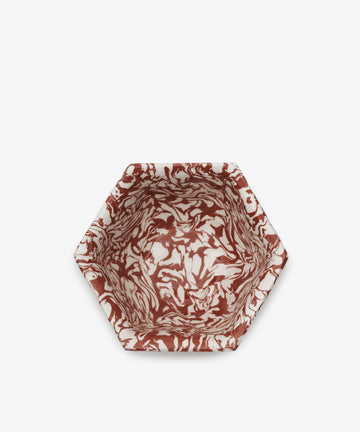 Celine Snack Bowl featuring a marbled red and white pattern, hexagonal shape, shown from above on a plain white background.