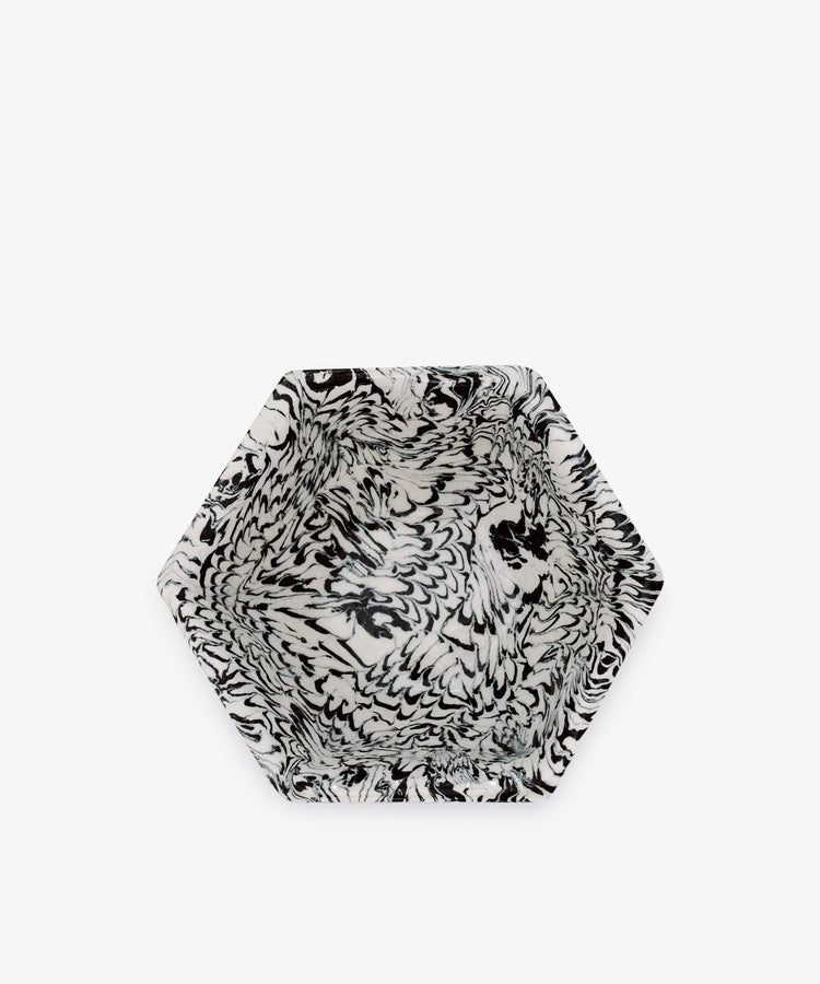 The Celine Snack Bowl features a hexagonal shape with a striking black and white marbled pattern on both the interior and exterior, reminiscent of handcrafted Aptware, shown from above against a plain white background.