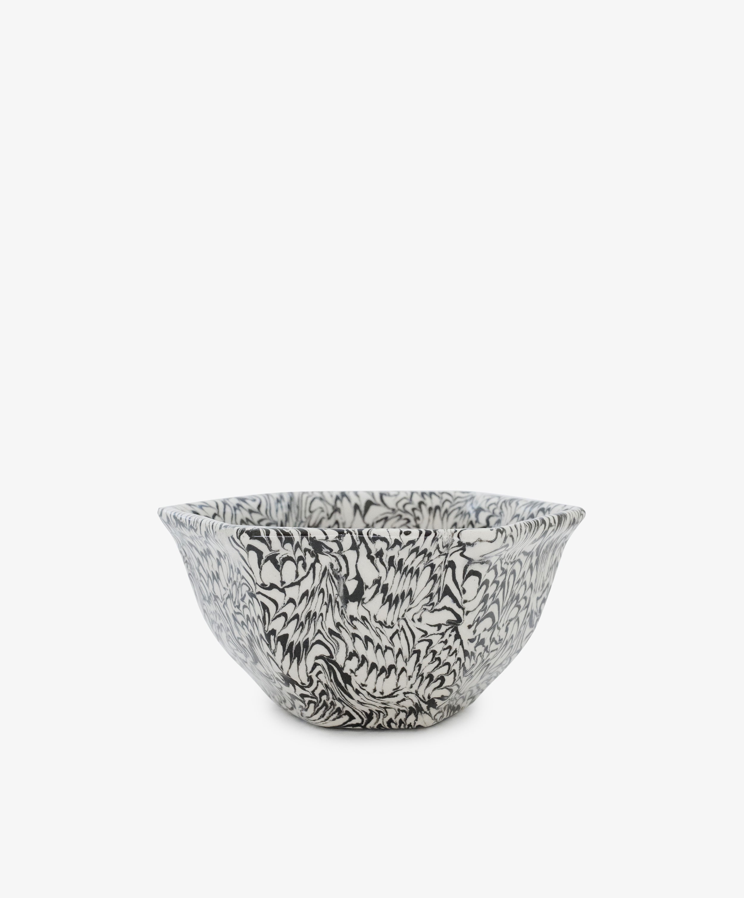 The Celine Snack Bowl is a handcrafted Aptware ceramic piece featuring a unique marbled effect with intricate black and white floral or leaf patterns, displayed against a plain white background.