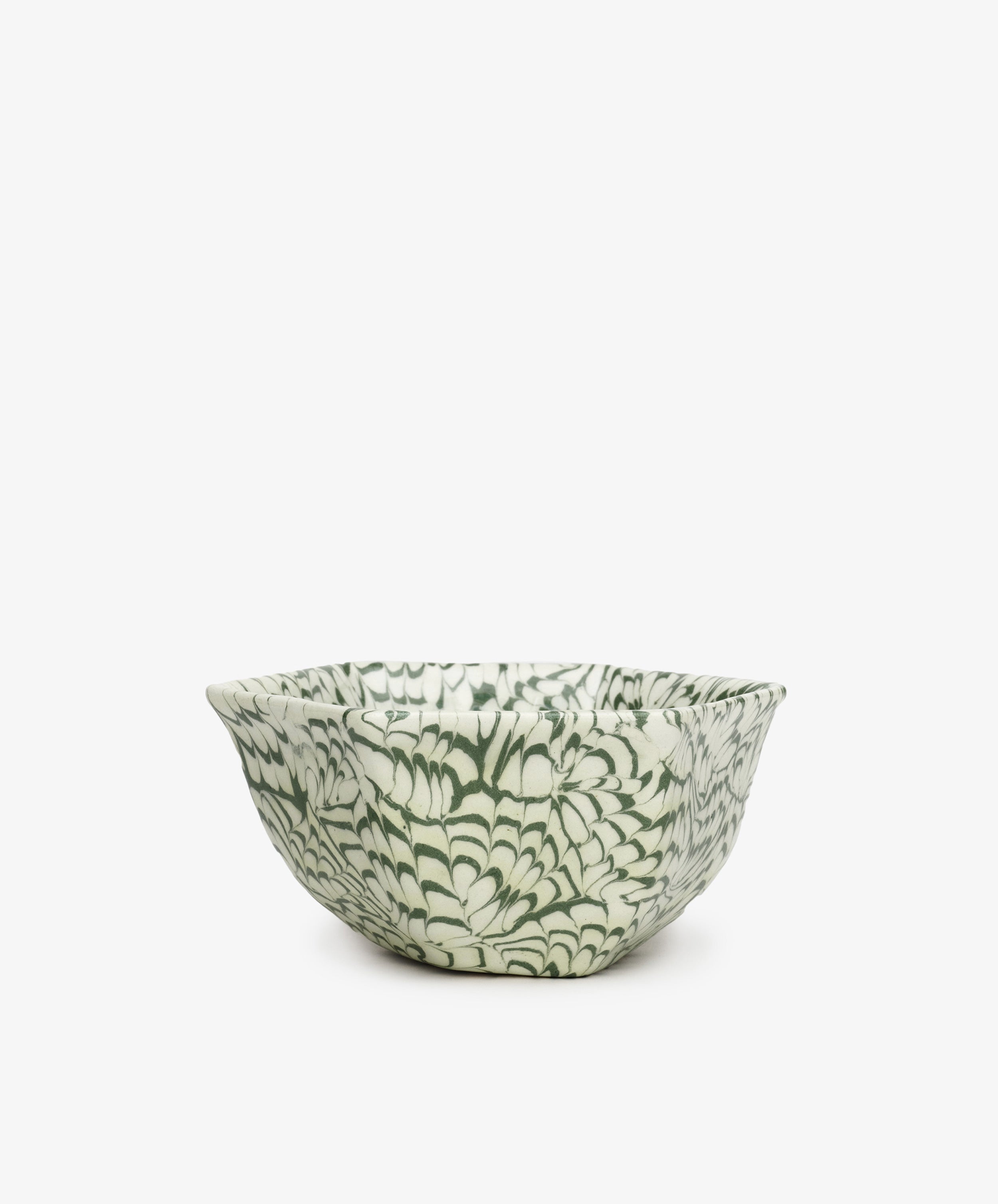 The Celine Snack Bowl features a handcrafted ceramic design with a green and white floral pattern on a plain white background—ideal as a marbled snack bowl for any occasion.