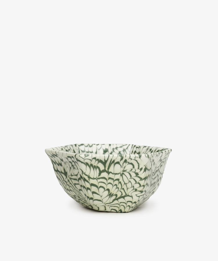 The Celine Snack Bowl features a handcrafted ceramic design with a green and white floral pattern on a plain white background—ideal as a marbled snack bowl for any occasion.