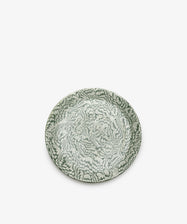 The Celine Serving Plate is a round, handcrafted ceramic platter featuring an intricate green and white floral pattern, beautifully photographed against a plain white background.