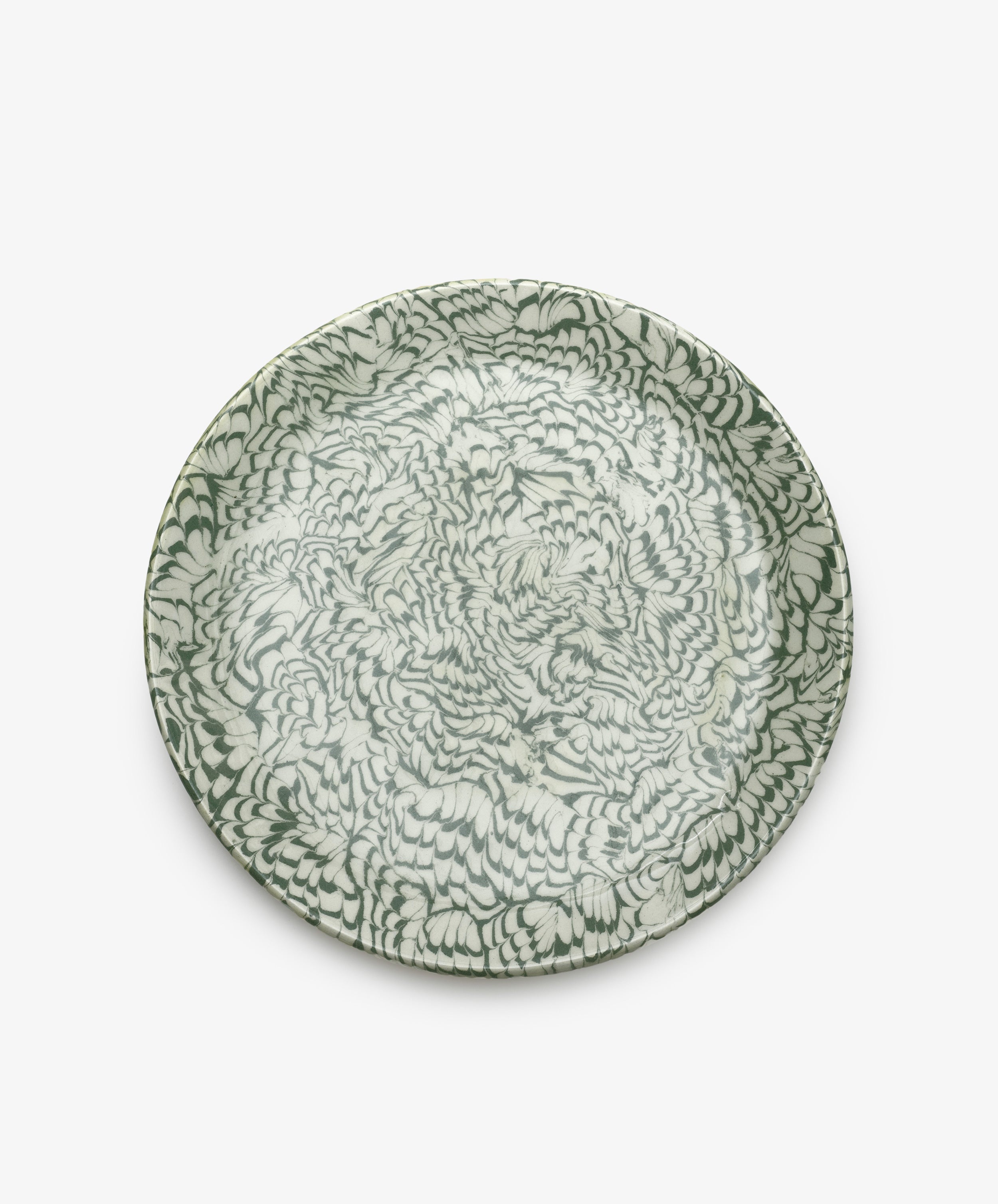 The Celine Serving Platter features a dense, abstract green and white feather-like pattern reminiscent of marbled ceramics, shown from above against a plain white background.
