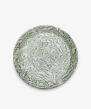 The Celine Serving Platter features a dense, abstract green and white feather-like pattern reminiscent of marbled ceramics, shown from above against a plain white background.