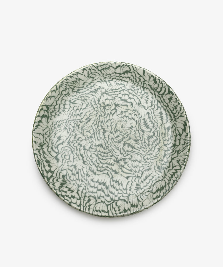 The Celine Serving Platter features a dense, abstract green and white feather-like pattern reminiscent of marbled ceramics, shown from above against a plain white background.