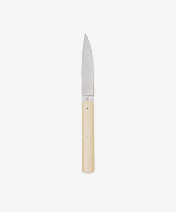 The 9.47 Table Knife is a small, handmade French knife with a straight stainless steel blade and a light-toned handle, photographed on a plain white background.