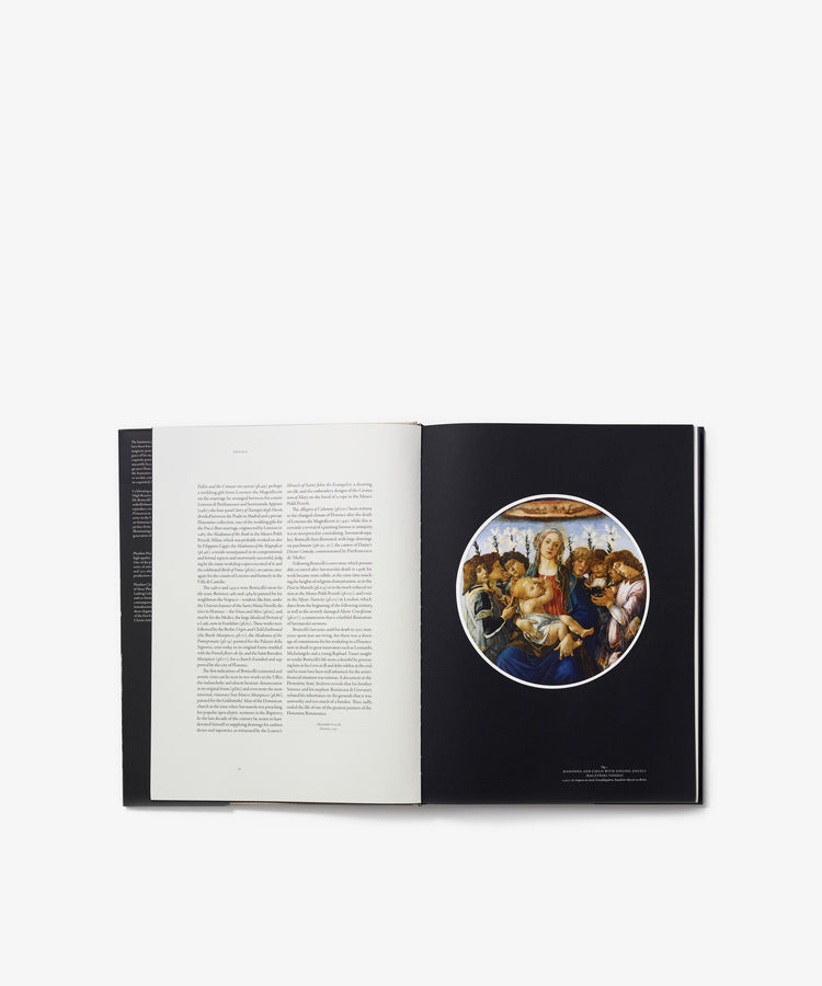 An open copy of Botticelli displays, on the left page, text, while the right page features a circular Renaissance painting in Botticelli’s style—a Madonna and Child surrounded by figures—capturing the grace and beauty characteristic of Renaissance art.