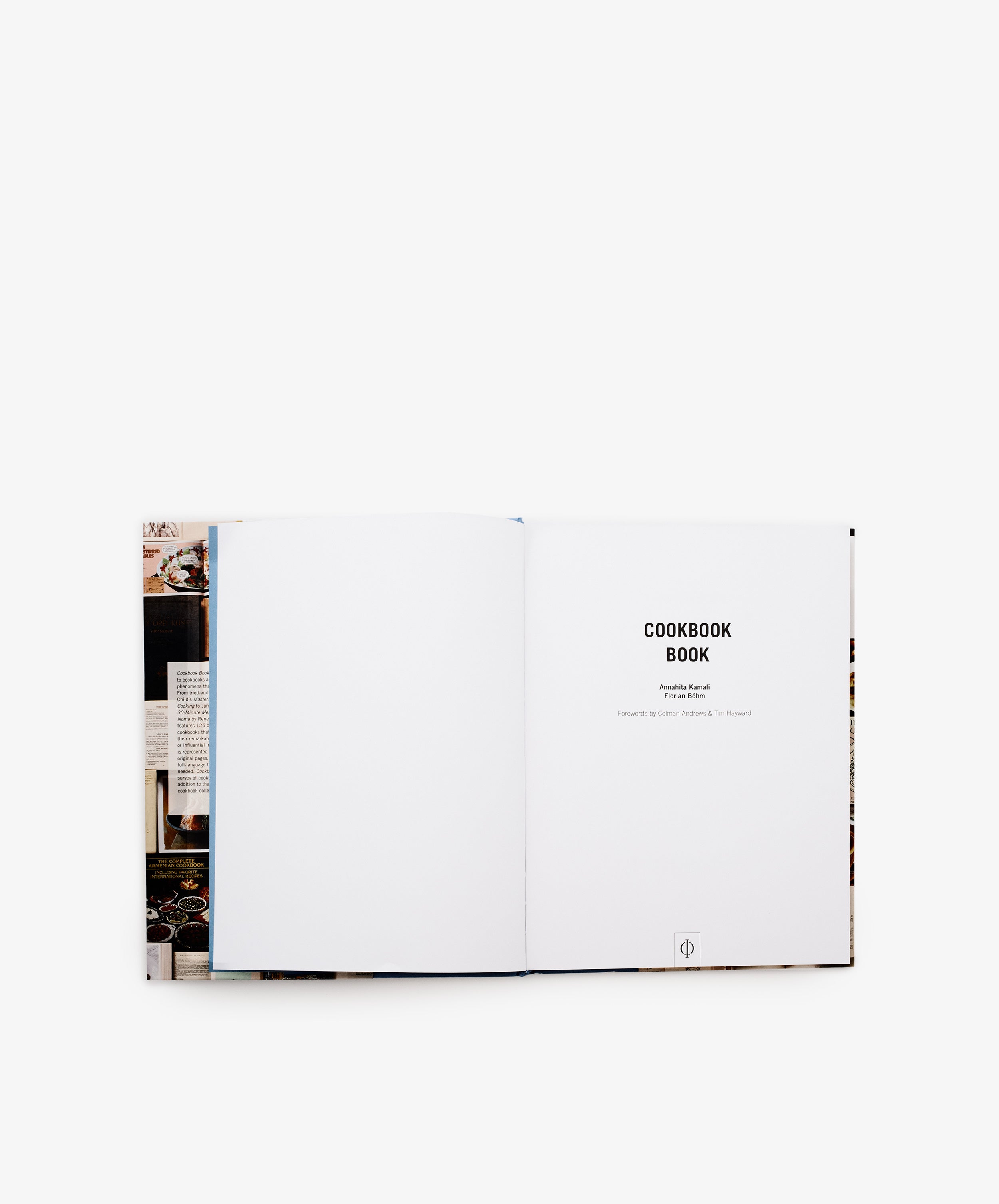 An open book displays a mostly blank left page and a right page titled Cookbook Book, offering a captivating look at timeless cookbook design—an ideal and unique addition to any vintage cookbook collection.