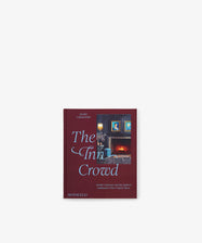 Book titled *The Inn Crowd: Artistic Getaways and the Modern Innkeepers Who Crafted Them* by Jackie Glarshmondo, featuring a dark red cover with a painting of a room adorned with framed portraits and blue highlights, evoking the timeless charm of historic properties or an inviting Northeast bed and breakfast.