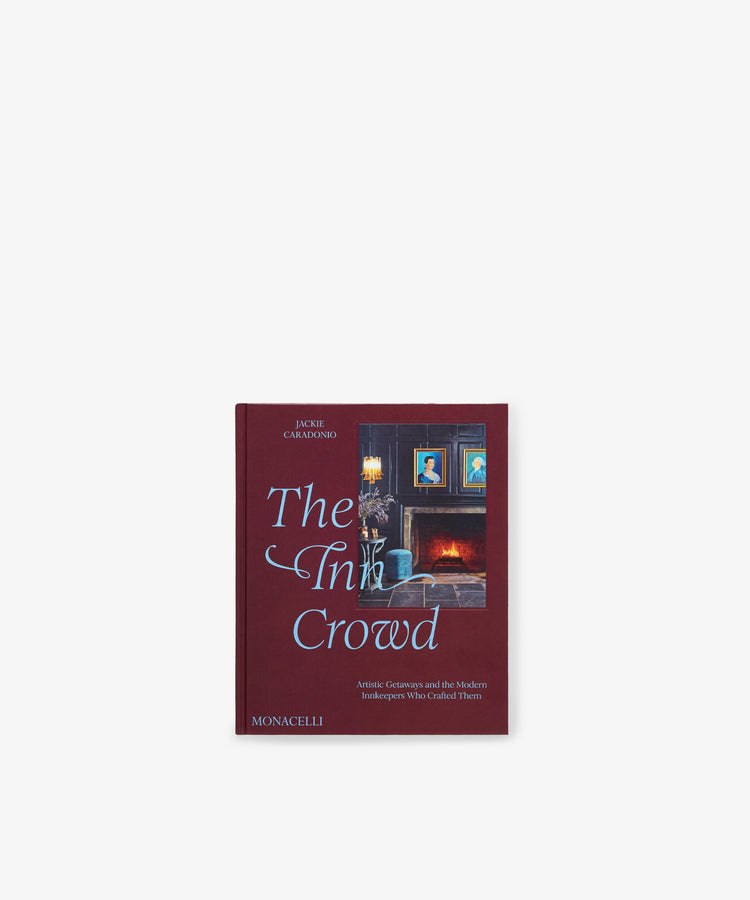 Book titled *The Inn Crowd: Artistic Getaways and the Modern Innkeepers Who Crafted Them* by Jackie Glarshmondo, featuring a dark red cover with a painting of a room adorned with framed portraits and blue highlights, evoking the timeless charm of historic properties or an inviting Northeast bed and breakfast.