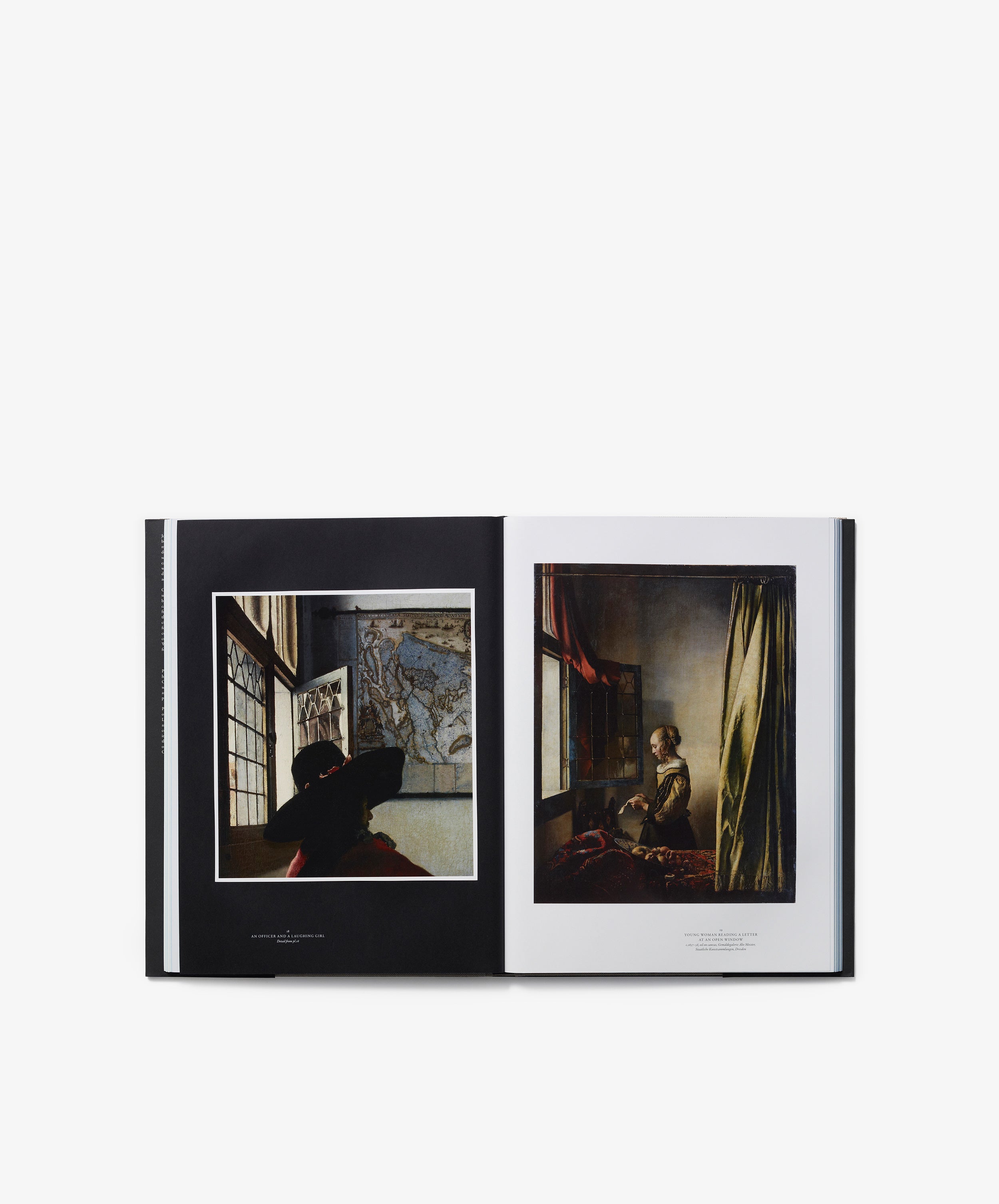 An open art book titled 