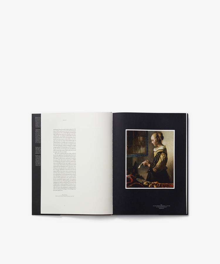 An open art book titled 