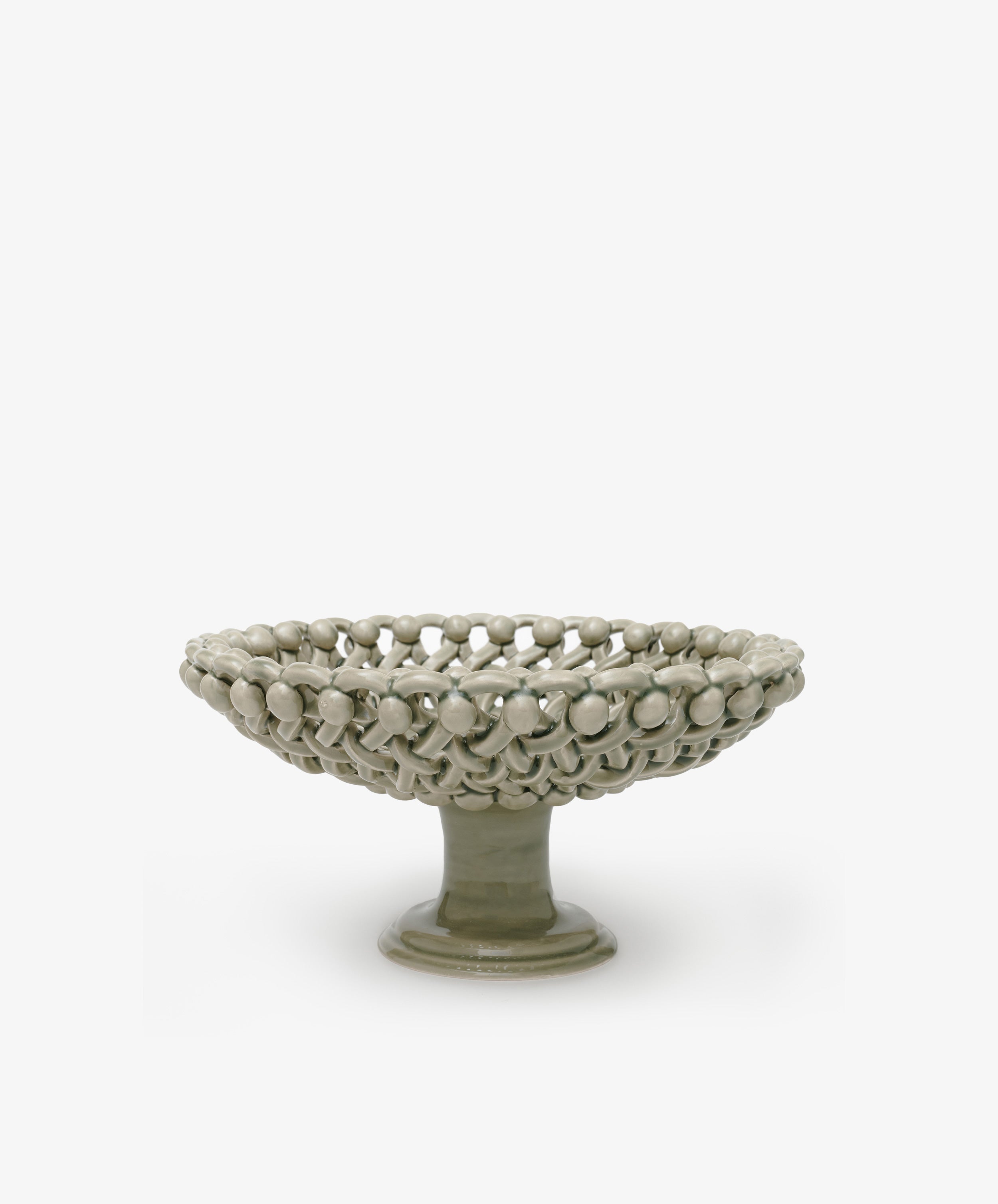 Decorative ceramic bowl with textured surface on a white background
