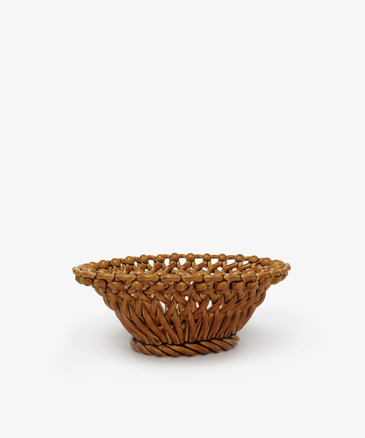 The Remi Decorative Fruit Bowl is a brown woven wicker basket with an open, round shape, shown against a plain white background.