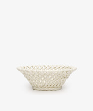 The Remi Decorative Flower Fruit Bowl is a shallow, round white ceramic piece featuring a woven lattice design that makes a sculptural statement against any plain white background.