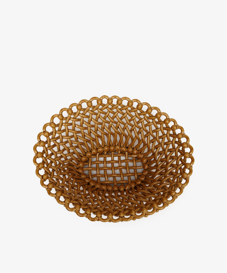 The Remi Decorative Fruit Bowl is a brown, oval showpiece with an open lattice design and ornate edges, displayed on a white background.