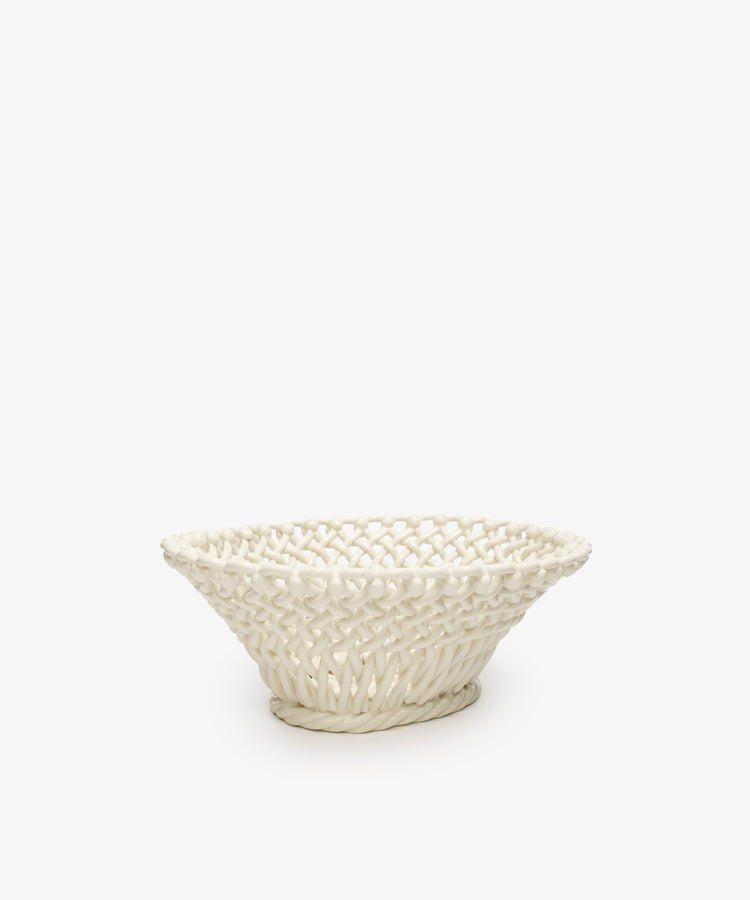 The Remi Decorative Fruit Bowl is a cream-colored woven ceramic piece featuring an open lattice design, beautifully crafted in the South of France and photographed on a plain white background.