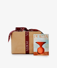 A Gift Wrapping package in brown paper with a burgundy PORTA ribbon sits beside a card showing an abstract red vase with 