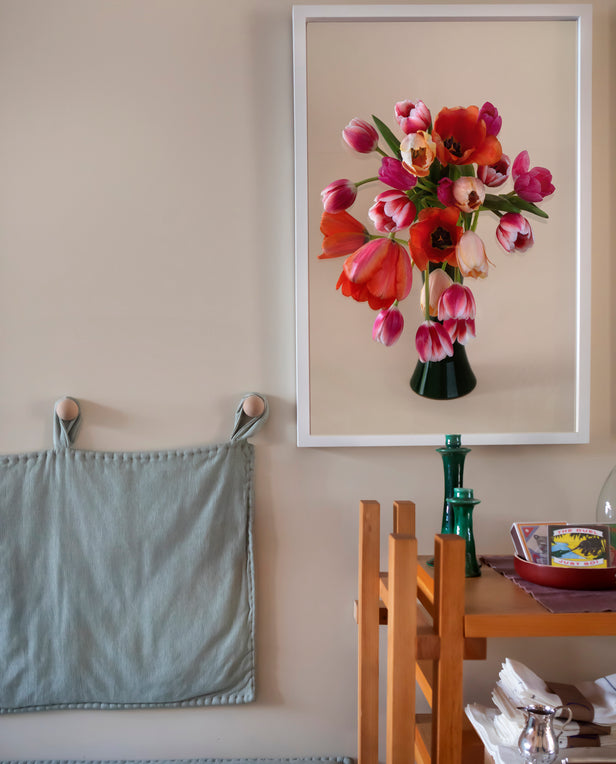 wood shelves green bench with floral print on wall