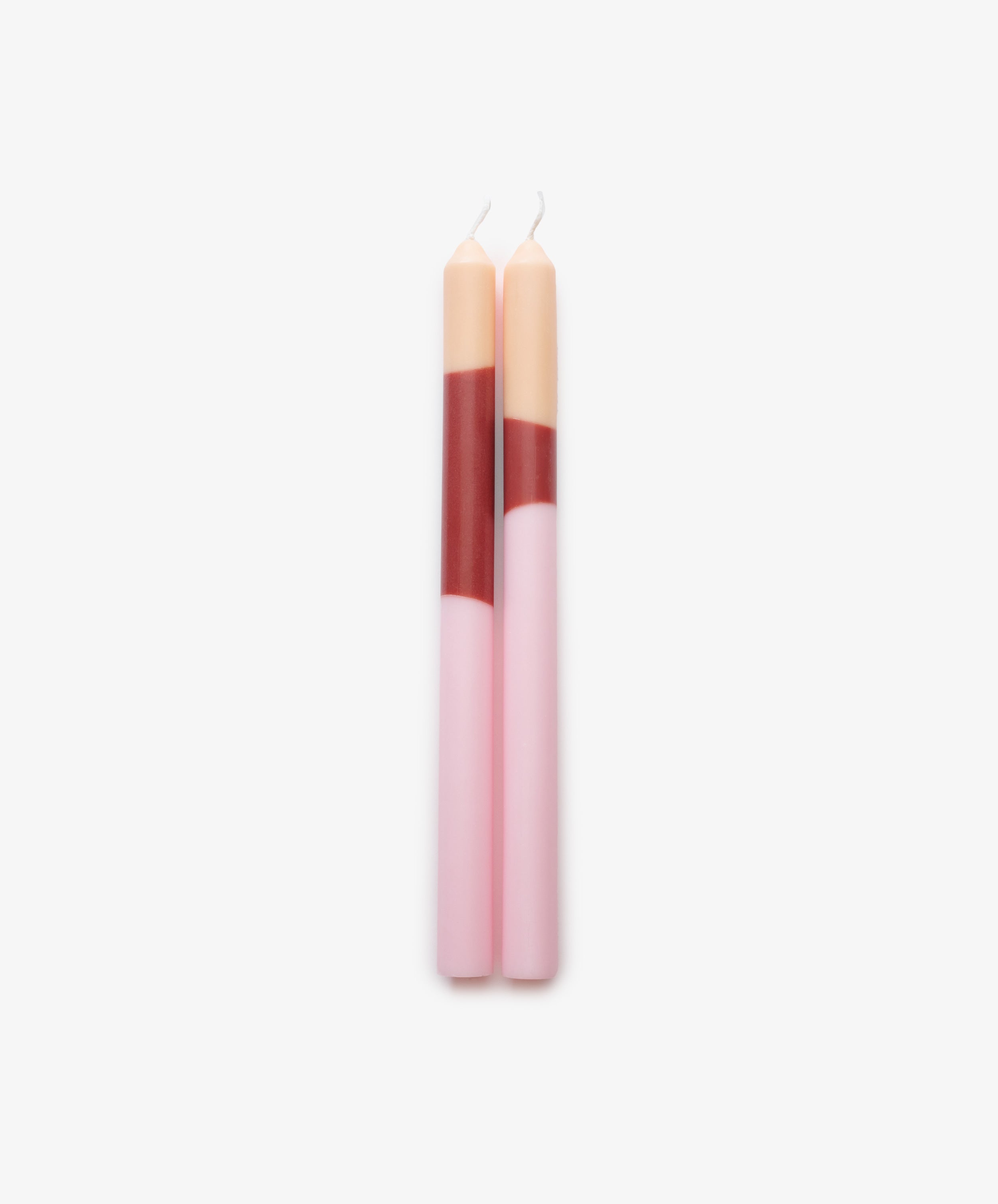 Deia Candle by Pygmalion. Light pink, wine red, and peach.