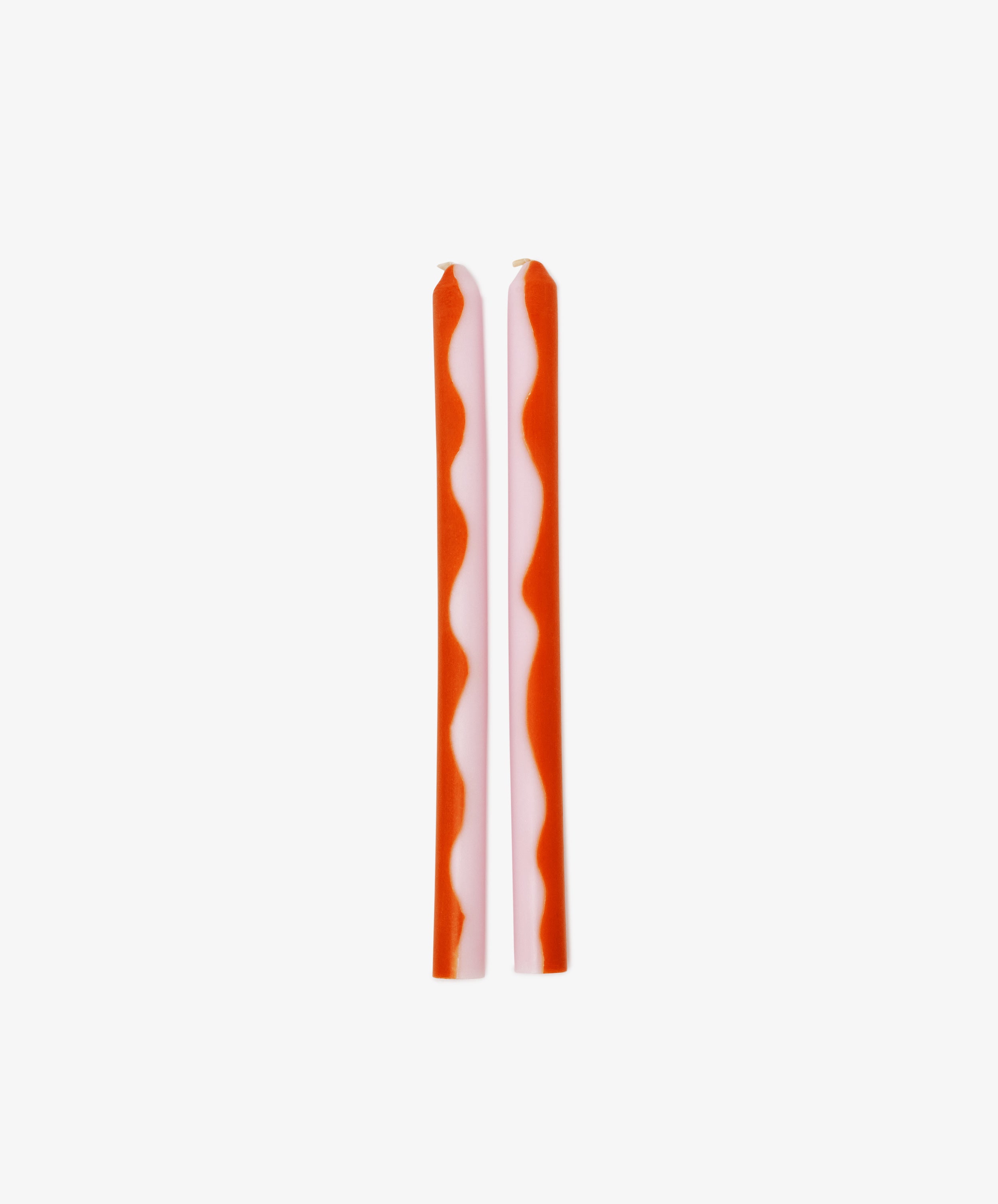 Two Marmalade Candles featuring red wavy stripes stand upright side by side on a plain white background.