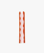 Two Marmalade Candles featuring red wavy stripes stand upright side by side on a plain white background.