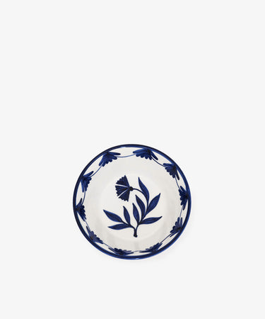The Catalina Cereal Bowl, Set of 4, includes small hand-painted ceramic bowls from Portugal with blue floral patterns on the inside and rim, set against a plain white background.