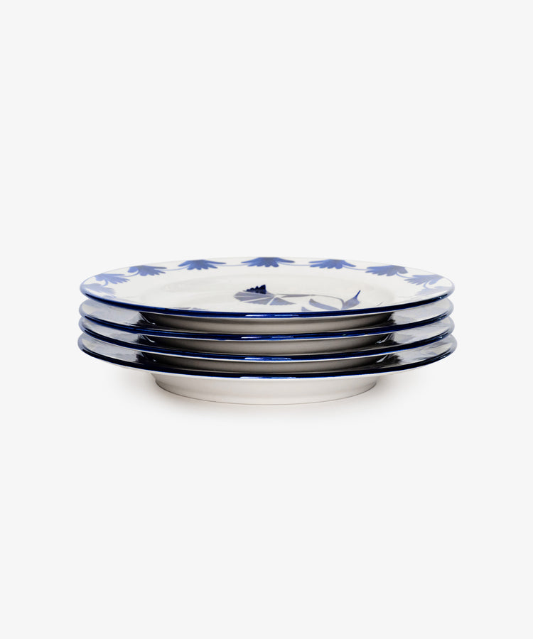 A set of four Catalina Dinner Plates, featuring blue floral rim patterns inspired by Portuguese dinnerware, is displayed against a plain white background.