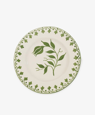 The Esmeralda Dinner Plate, Set of 4, features white ceramic plates with a handmade green floral center design and a green decorative rim.