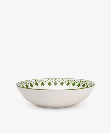 The Esmeralda Serving Bowl is a white hand-painted ceramic bowl featuring a green decorative pattern around the rim, shown on a plain white background.