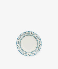 The Ottoline Cereal Bowl, Set of 4, features a round ceramic design with a white center and blue patterned border, displayed on a plain white background.