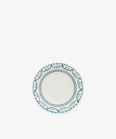 The Ottoline Cereal Bowl, Set of 4, features a round ceramic design with a white center and blue patterned border, displayed on a plain white background.